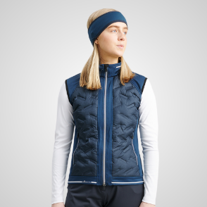 Model wearing Abacus Ladies Grove Hybrid Golf Vest Front View Peacock Blue